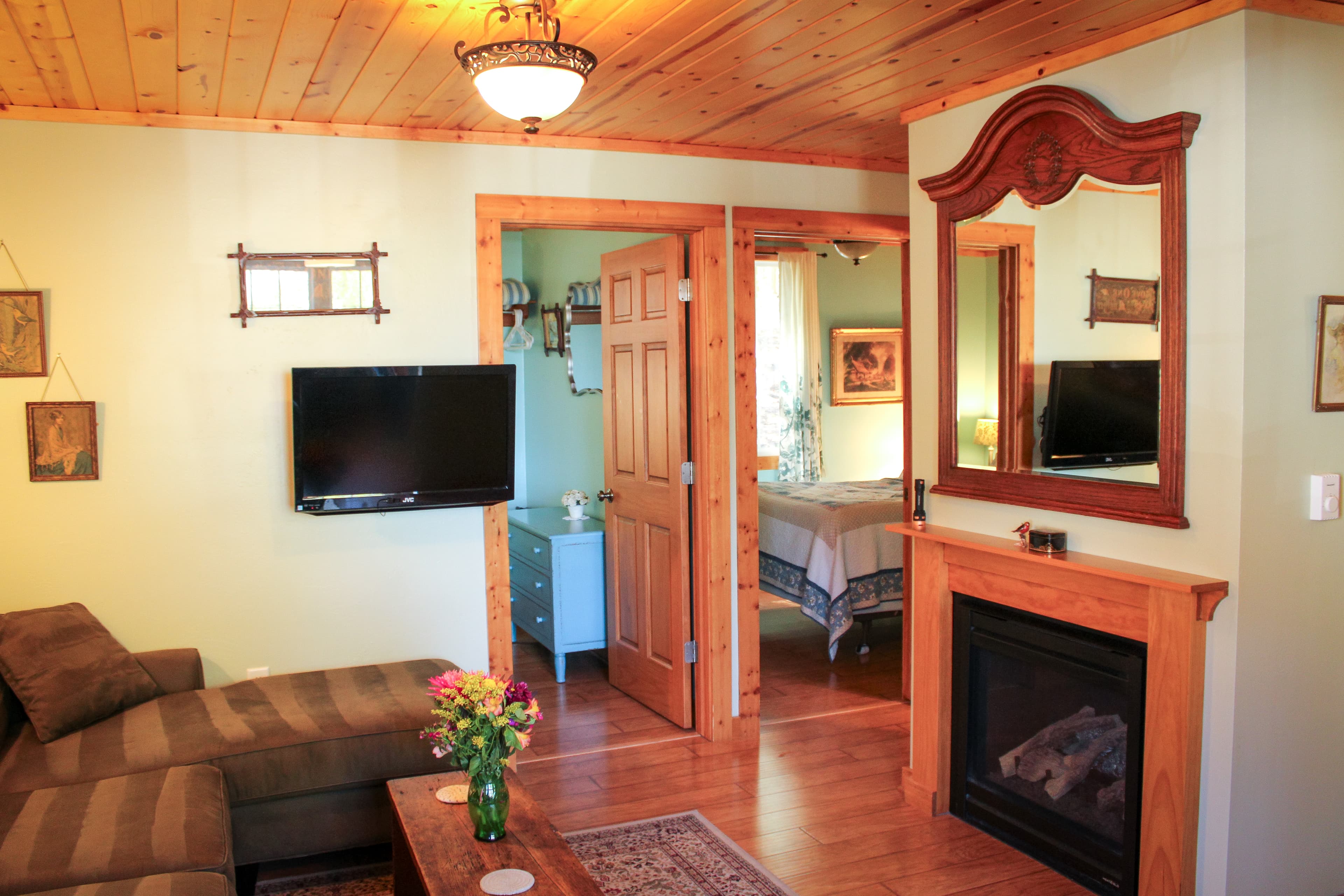 Family room with fireplace and TV with couch and chairs